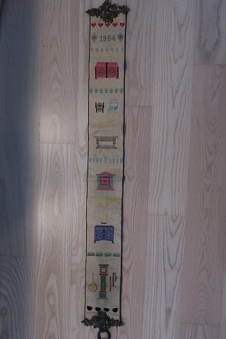 An old bell wireHandmade with petit point (very tiny cross stiches)Please note the beautiful item for the hangingL: 118B: 15cm