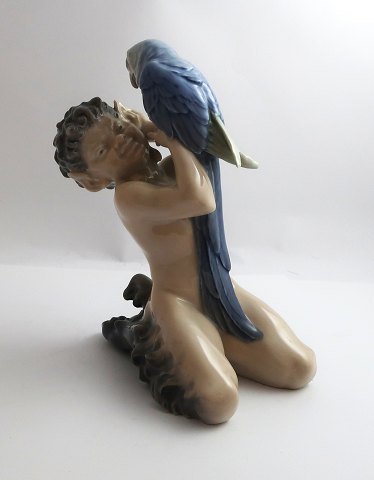 Royal Copenhagen. Porcelain figure. Faun with parrot. Model 752. Height 19 cm. 
(1 quality)