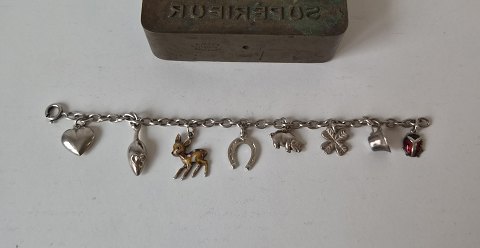 Vintage sølv barnearmbånd med 8 charms