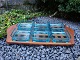 Cabere wood dish with 6 loose greenish glass bowls designed by Quistgaard. 
L: 44 cm W: 25 cm, in perfect condition. 
5000 m2 showroom.