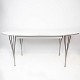 Super Ellipse spisebord med hvid laminat designet af Piet Hein og Arne Jacobsen, 
samt fremstillet af Fritz Hansen i 2011.
