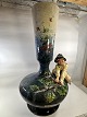 Vase.Hidhørt
Ålholm slot 
.nr 63-6 med 
figur 
Dreng ...