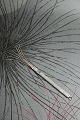 Old champagne whisk in silver. 
L: 8cm. can be hung on a chain. Stamped 925S.