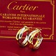 Cartier; Par medium Trinity øreringe af 18 kt. guld
