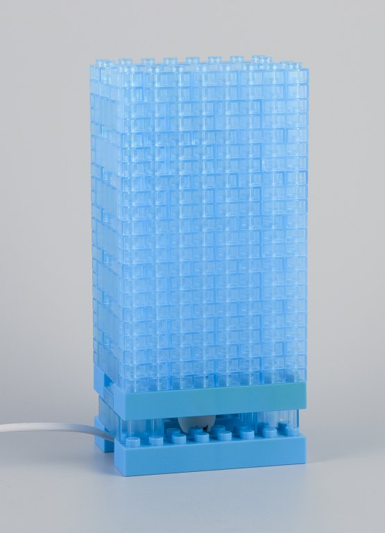 Scandinavian design. Table lamp in light blue plastic.