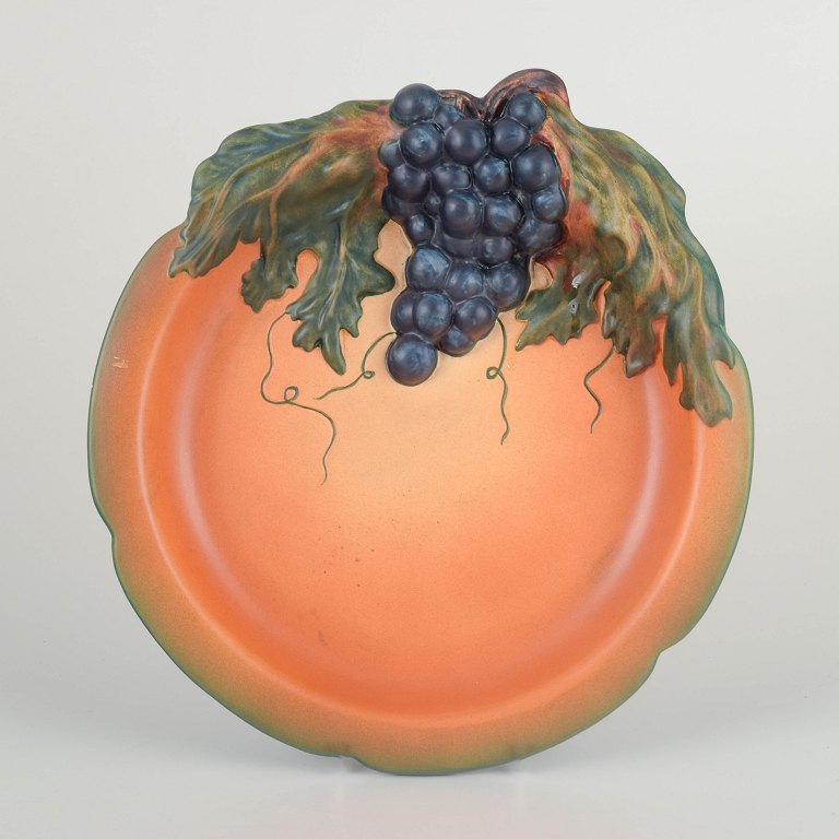 Ipsens EnkeDecorative wall dish with grape motif, ca. 1920s/30s.