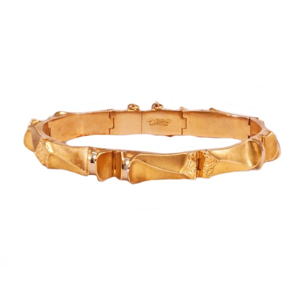 Lapponia 18kt guld leddelt armlænke med kasse- og sikkerhedslås og -kæde år 1980. L: 18,5cm