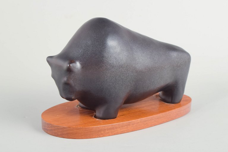 Lillemor Petersson for Rörstrand, bull figure on wooden stand.